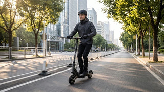 Adult rider wearing a helmet riding a NAVEE ST3 Pro premium commuter electric scooter smoothly along a paved city bike lane