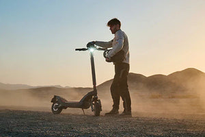 Riding an electric scooter on the wilderness road